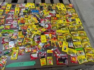 lot 195 image: TABLE FULL OF FISHING PLASTICS