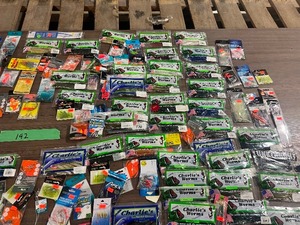 lot 192 image: TABLE OF FISHING LURES AND PLASTICS