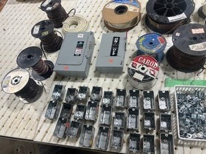 lot 163 image: TABLE FULL SPOOLS OF WIRE, JUNCTION BOXES, & ELECTRICAL ITEMS