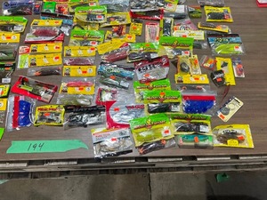 lot 194 image: TABLE FULL OF FISHING PLASTICS