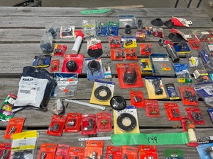 lot 149 image: TABLE FULL OF PLUMBING PARTS