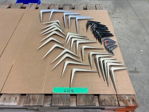 lot 208 image: TABLE FULL OF SHELF BRACKETS