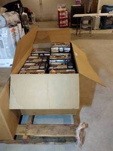 lot 212 image: Approx 44 boxes of DVDs. The title featured reads FBI CIA films on 17 DVDS