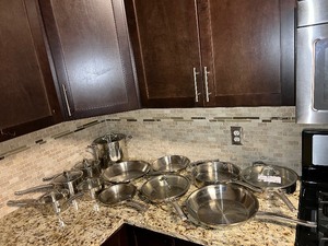 lot 304 image: (19) Calphalon Pots or pans, many have lids.