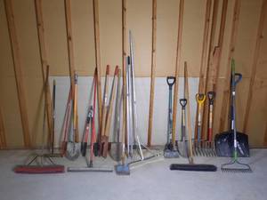 lot 297 image: Garden Tools mostly, with one snow shovel, a push broom, long-handled squeegee, pole digger, pruning shears
