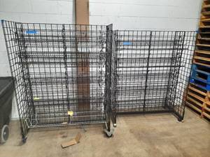 lot 377 image: 2 Black Wire Merchandising Racks on wheels. Measures 50 W X 24 D X 67.5 H and 51W X 24D X 65H.