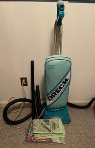 lot 107 image: Oreck Vacuum Cleaner with attachments and bags