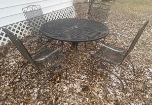 lot 118 image: Iron Patio set and four chairs