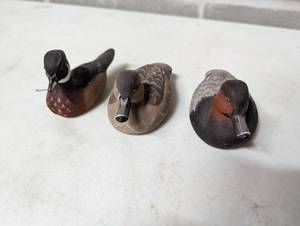 Three Duck Figurines