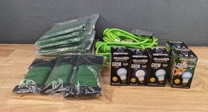lot 120 image: New Miracle LED Grow Lightbulbs, Green Nylon Plant Ties, and Green Extension Cord F