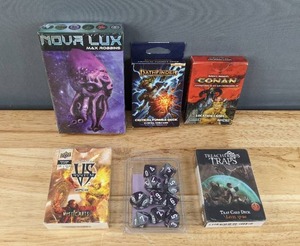lot 103 image: New Collection of Adventure Games Including Nova Lux, Pathfinder, Conan, and More F