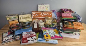 lot 91 image: A Collection of Family Games, Signs, Disney Activity Books, Crosswords, Greeting Cards, and Music Boxes R