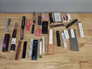 lot 24 image: Assorted New and Used MakeupAccessories - Eyeliner, Mascara, Concealer, Serum, Lip Scrub, Complex Culture Brush Set, and more R
