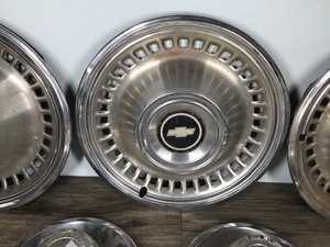 lot 145 image: Lot of 7 Vintage Chevy Hub Caps