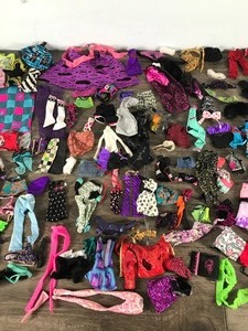 lot 239 image: Lot of Monster High Doll Clothes and More ( Not sure if it is all monster high doll clothes)