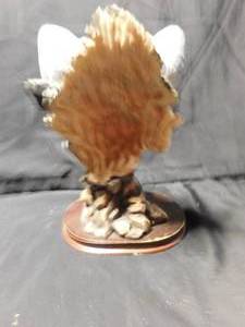 lot 256 image: Heavy ceramic wolf on wood