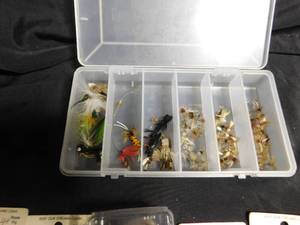 lot 308 image: Container of fishing flies and a Plano tackle box