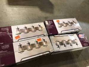 lot 20 image: Lot of 4 Home Decorators Collection Georgina 30 in. 4-Light Weathered Iron Industrial Rustic Vanity with Clear Seeded Glass Shades and Cage Accents     Customer Returns See Pictures
