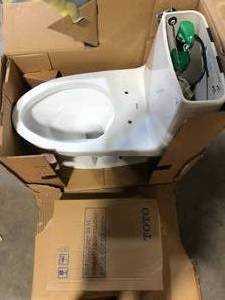 lot 50 image: TOTO Eco UltraMax 1-Piece 1.28 GPF Single Flush Elongated Standard Height Toilet in Cotton White, SoftClose Seat Included    Customer Returns See Pictures