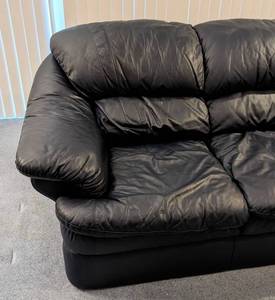 lot 26 image: Navy Blue Leather Sofa