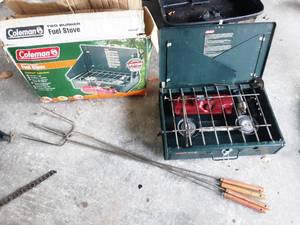 lot 49 image: coleman 2 burner camp stove and 4 fire cookers