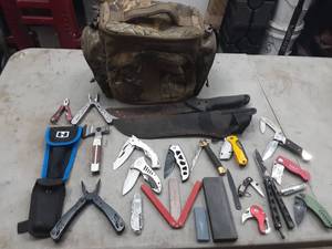 lot 54 image: camo lunchbox with pocket knives, multi tools, more