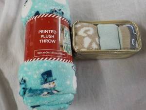 lot 35 image: Printed New Plush Throw and 3 pack Cozy Socks
