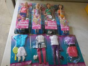 lot 66 image: 4 Barbie New Dolls and clothes...