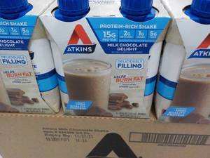 lot 158 image: 12 x 11 oz Atkins Protein Rich Milk Chocolate Delight Shakes best date 112023