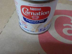 lot 298 image: 24 ct 5 oz Cans Nestles Carnation Evaporated Milk - best date 08312023