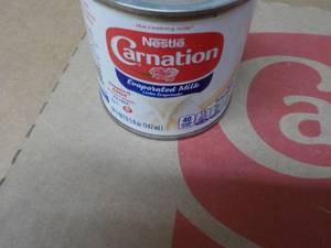 lot 300 image: 24 ct 5 oz Cans Nestles Carnation Evaporated Milk - best date 08312023