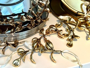 lot 124 image: Pottery Barn Decorative Metal Charges and Golden Colored Ornaments
