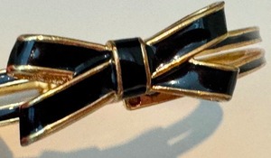 lot 127 image: Kate Spade Hinged Cuff Black Bow Bracelet