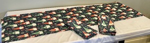 lot 236 image: Gnome Pattern Table Runner and Matching Cloth Napkins