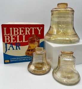 lot 33 image: Vintage Liberty Bell Jar and Piggy Banks