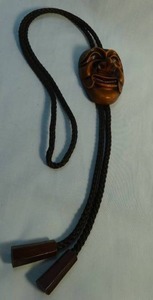 lot 341 image: Vintage KOREAN HAHOETAL Yangban Wood Look Face Mask Bolo Tie