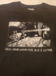 lot 424 image: Tom Petty 2002 - Sell Your Computer Buy A Guitar TShirt