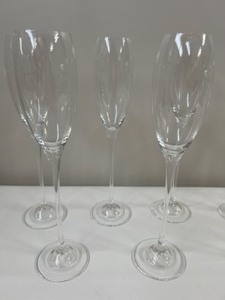lot 12 image: 9 Tall Stemmed Fluted Champagne Glasses