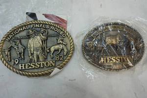 lot 322 image: 1981 & 1982 Hesston Nationals Final Rodeo Buckle
