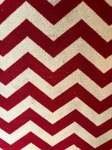 lot 121 image: Two Red and Light Tan Chevron Rugs  Mats