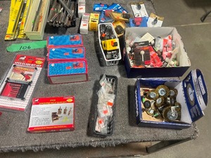 TABLE FULL OF DREMEL ATTACHMENTS, STAR DRILLSM GLASS BITS, WIRE WHEELS, & DRILL CHUCKS