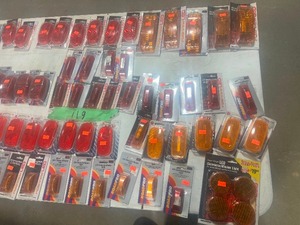 TABLE FULL OF AN ASSORTMENT OF AMBER & RED LED MARKER LIGHTS