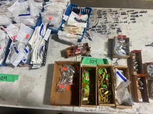 TABLE FULL OF ORINGS, OIL DRAIN PLUGS, & FUEL FILTERS