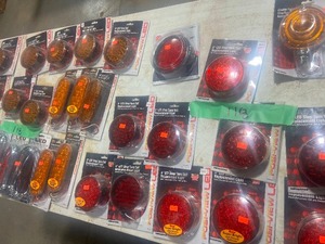 TABLE FULL OF AN ASSORTMENT OF AMBER & RED LED TAILTURNSTOP LIGHTS