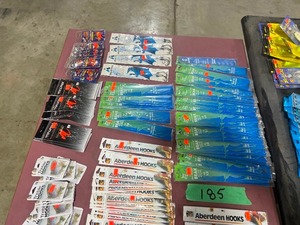 TABLE FULL OF DIFFERENT HOOKS & FISHING JIGS