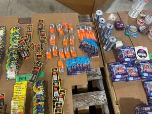 TABLE FULL OF FISHING LINE, JIGS, AND DIFFERENT SIZE HOOKS