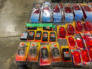 TABLE FULL OF DOME LIGHTS, TAILLIGHTS, & TRAILER SIDE LIGHTS