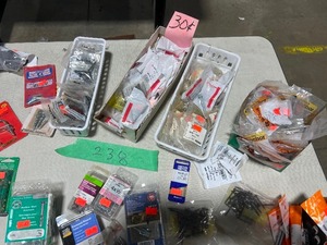 TABLE FULL OF AN ASSORTMENT OF POP RIVETS, HANGER BOLTS, SCREWS, AND FASTNERS