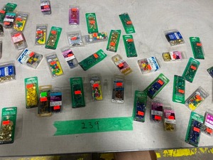 TABLE FULL OF DIFFERENT COLOR THUMB TACKS