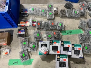 TABLE FULL OF A VARIETY OF SCREWS